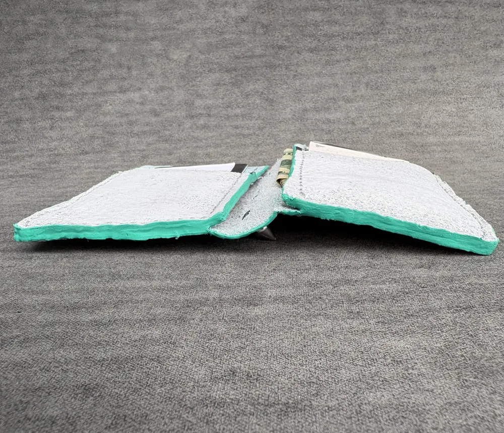 Wallet opened flat, viewed from the bottom to highlight turquoise edge painting